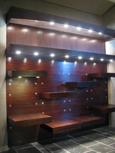 Mahogany adjustable shelving with bottom lighting